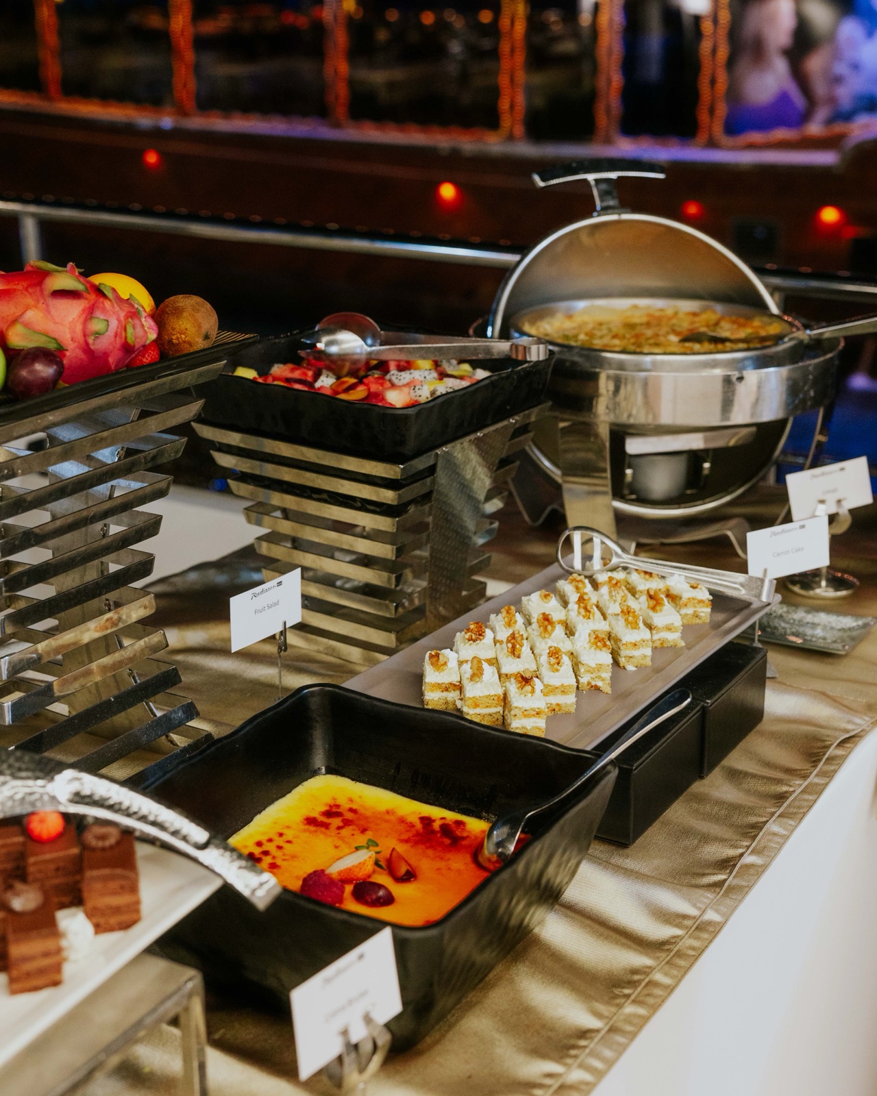 Dessert counter featuring an array of pastries and sweets