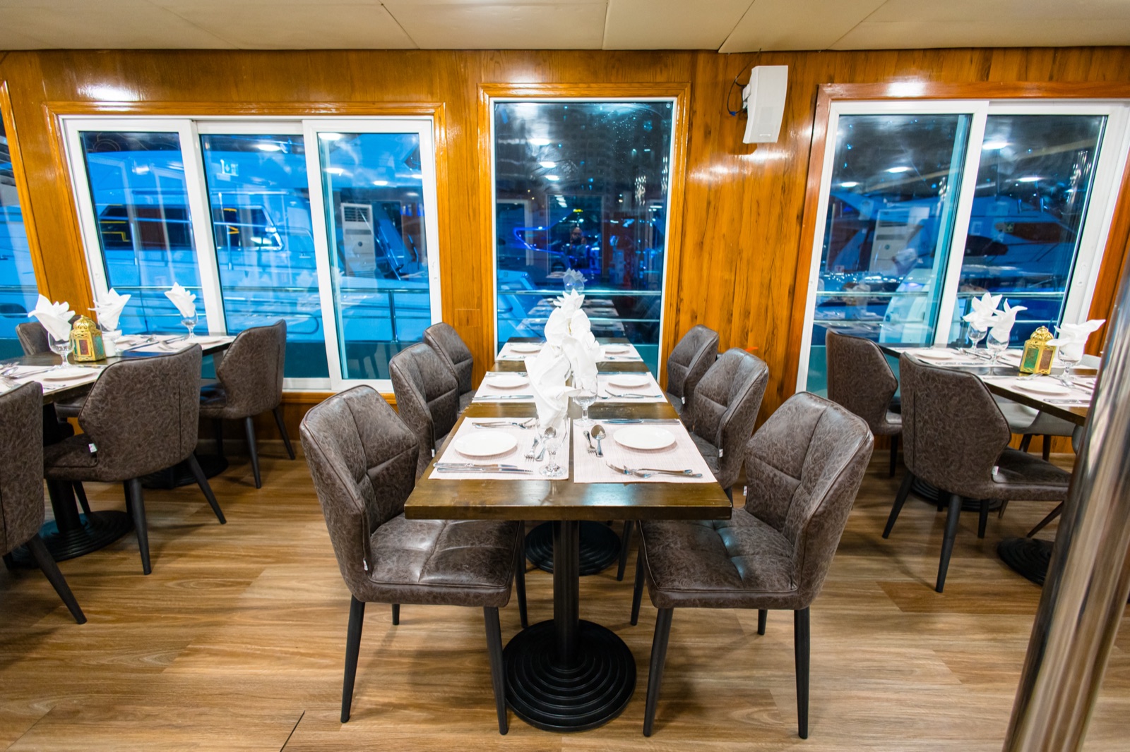 Lower deck table set with fine dinnerware and floral accents