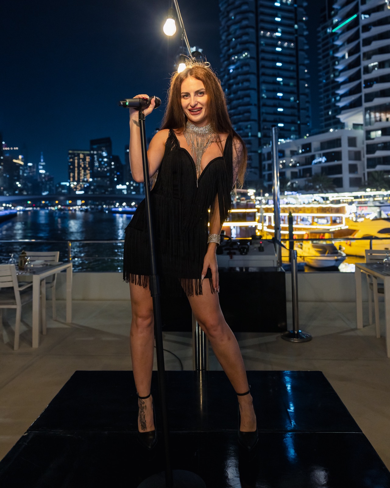 Live singer performing on stage during the evening cruise