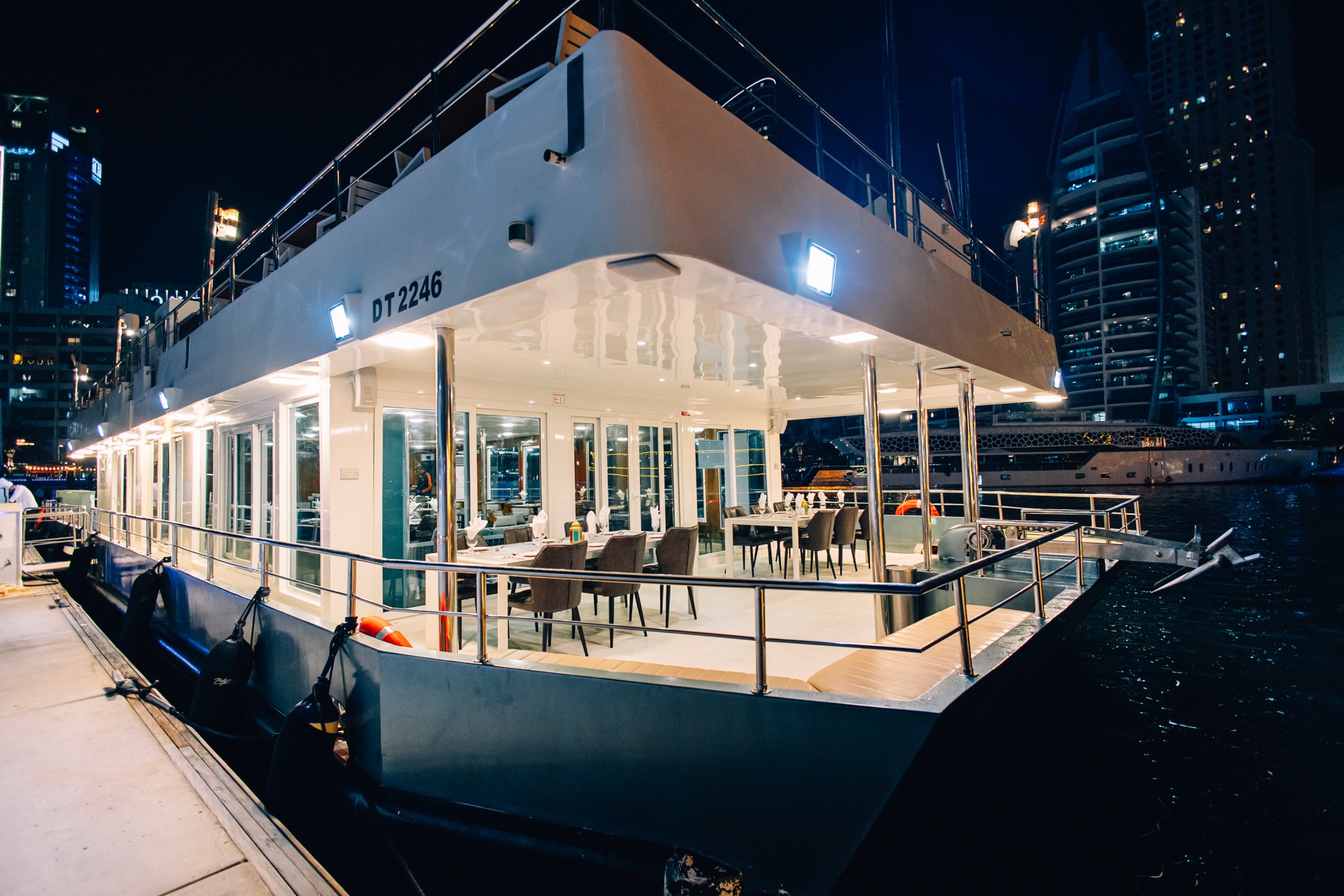 Alexandra Sea Lounge catamaran cruising Dubai Marina at night